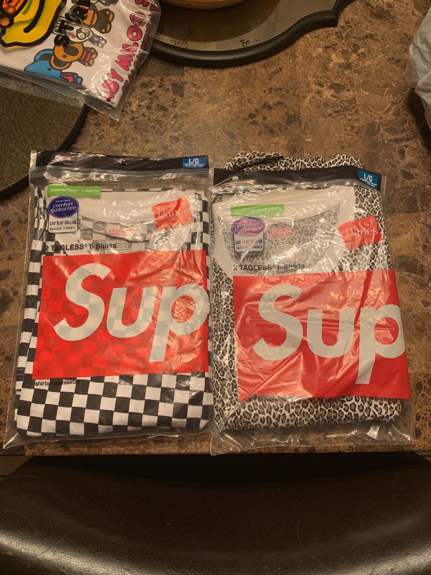 Two Supreme tees