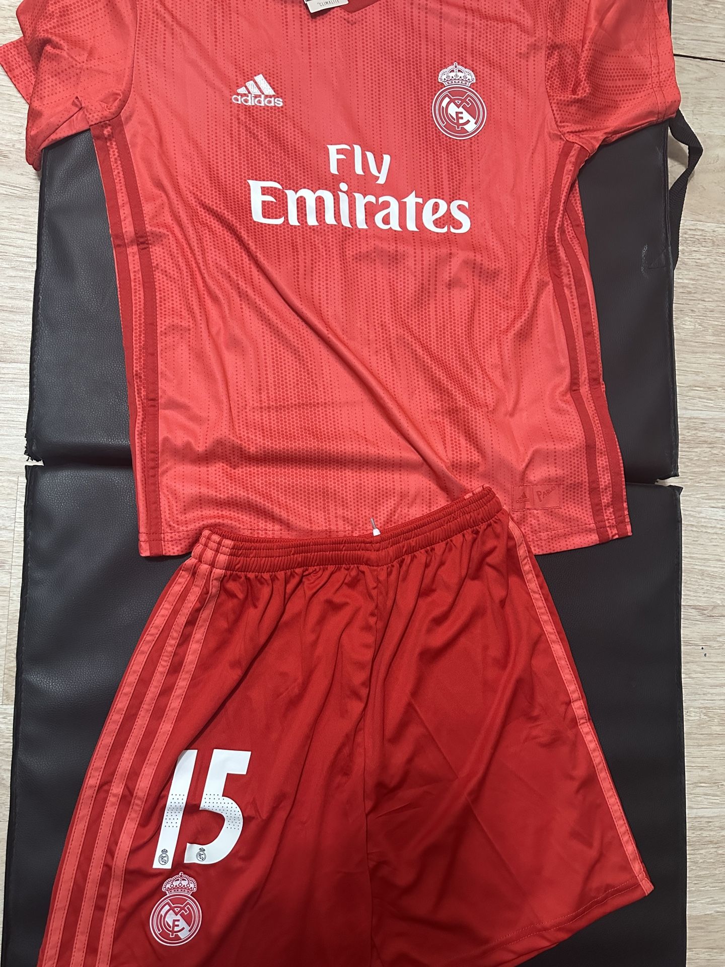 This is an Adidas Real Madrid 2018/19 Third Jersey in the " Real Coral" color Number 15 AJ