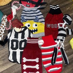 Preowned in good condition 5 boy doggie clothes size M ,  5 doggie toys and one medium harness