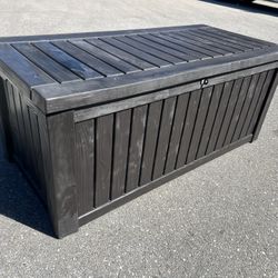 Delivery Available! 61x28x26In Keter 150 Gallon Backyard Deck Box Outdoor Patio Garden Lockable Patio Storage Container & Pool Accessory Organizer, Br