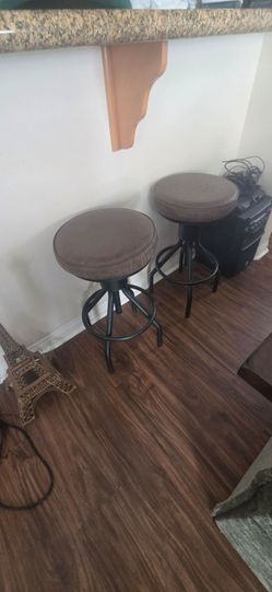 Swivel brown leather bar stools