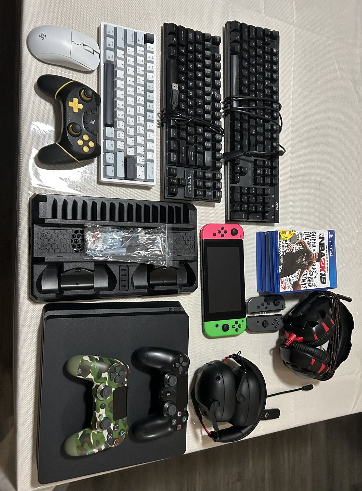 PS4 Barely Used Nintendo Switch Fortnite Edition 6 PS4 Games 2 Gaming Headsets 3 Gaming Keyboard 1 Gaming Mouse PS4 Stand Three Controllers Cables