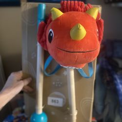 B. toys Orange Dinosaur Rocking Ride-On Toy with Sound Effects