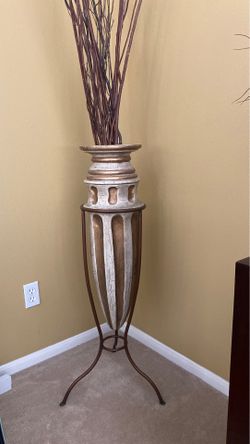Ceramic vase with rod iron stand