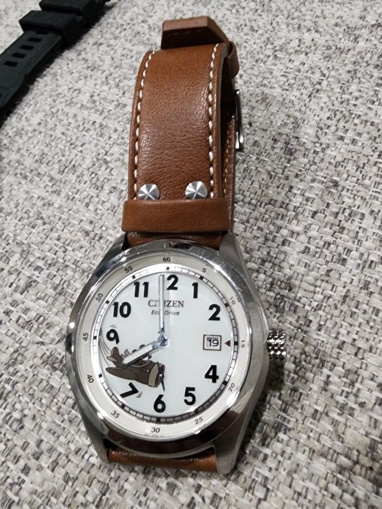 Citizen Eco-Drive Disney Mickey Mouse Aviator Watch with a tan leather strap and an ivory dial.