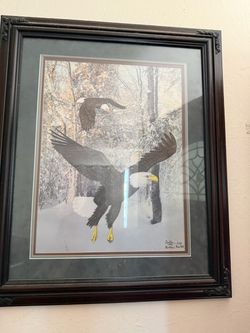 limited-edition bald eagle print dated 1999, signed by the artist Butler (possibly Tom Butler), depicting two bald eagles flying over a snowy, wooded 