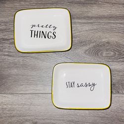 Two jewelry trinkets.