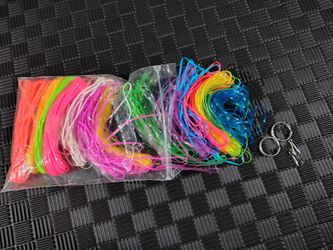 plastic lacing cord, also known as gimp, boondoggle, or scoubidou string, used for crafting keychains and bracelets