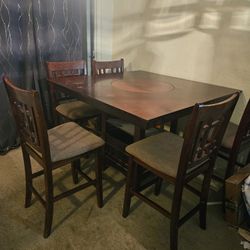 Solid Cherry wood dining room table with 5 chair with built in lazy susan.