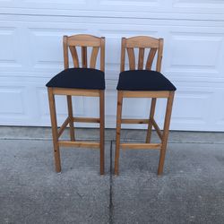 Two (2) vintage solid wood bar stools freshly upholstered 