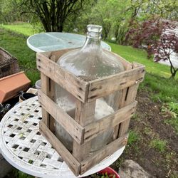Decorative Gallon Jug In A Wooden Crate