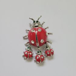 Vintage brooch pin Ladybug with 3 babies silver tone green eyes, one stone is missing