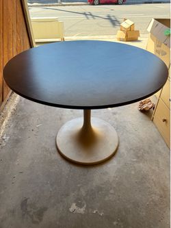 IKEA black circular table with gold painted base