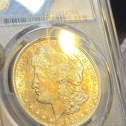 1921PCGSMS 621 dollar Morgan silver with the gold badge and with a nice gold ton