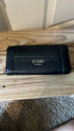 Woman’s black guess wallet