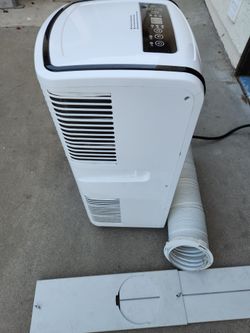 Like new portable ac with hose/ window kit/ blows ice cold air fast/ can test before buying