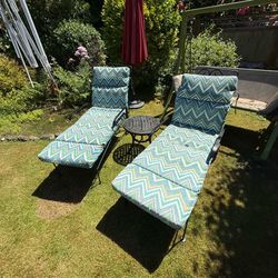 Wrought iron lounge chairs with cushions