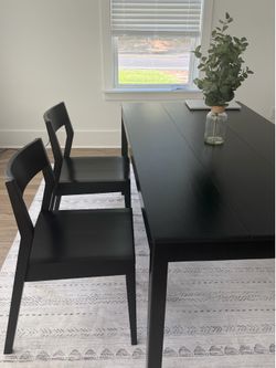 2 modern black dining chairs
