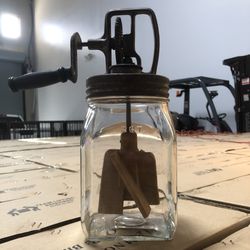 Authentic vintage 2-QT hand-crank butter churn with original glass jar, metal lid, and wooden paddles. With Milk Bottle