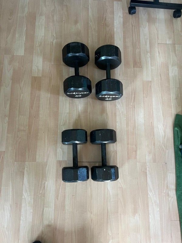 (2) 40. (2) 30 Lbs Dumbbells