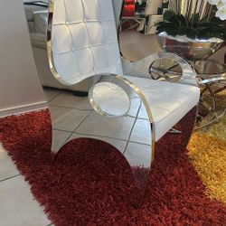 Furniture From El Dorado Accent Chairs, Coffee Table  And Orchid Arrangement In Silver Base
