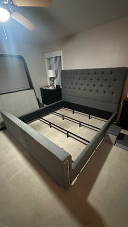 Grey upholstered bed frame and box springs