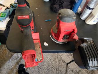 Milwaukee 12 volt pruning saw 18 volt orbital sander with 1 12 volt battery, 1 18 volt battery