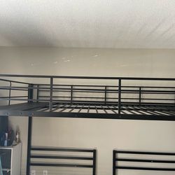 Black Metal Loft Bed Frame with 2 Twin bed frames at the bottom and top full size.
