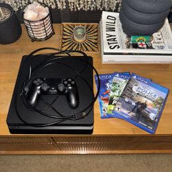 PS4 with controller and games 