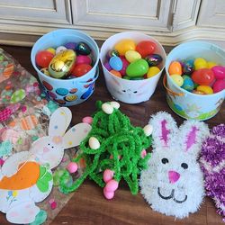 3 Easter baskets with grass and 80 eggs and Easter decorations