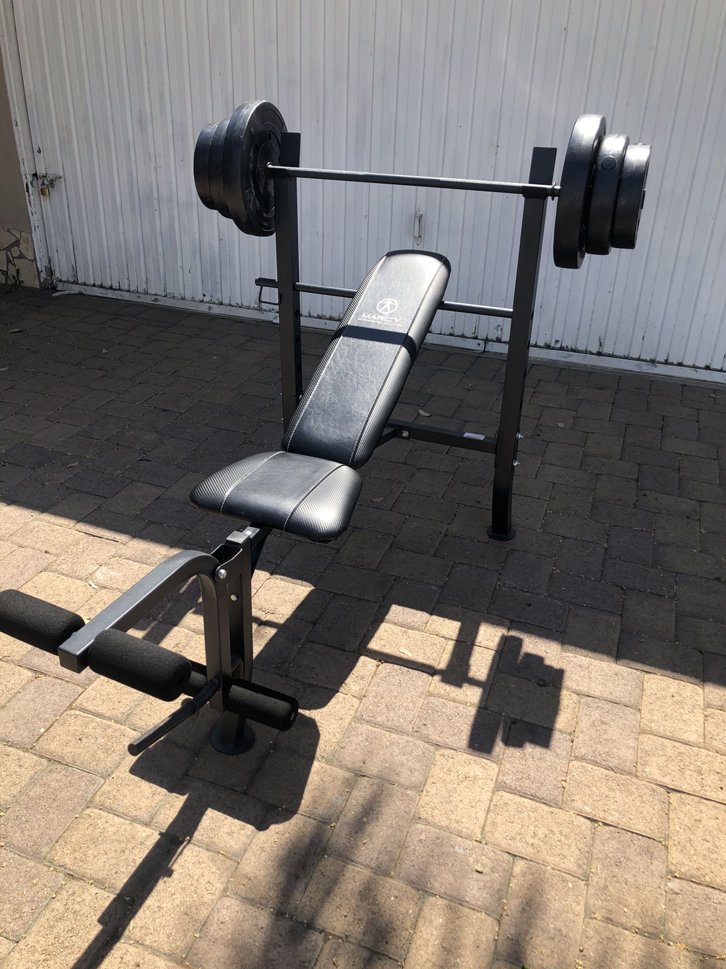 Bench press with Barbell and 100 lb Weight Set combo with leg developer