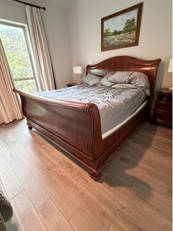 Eastern king sleigh bed and two nightstands