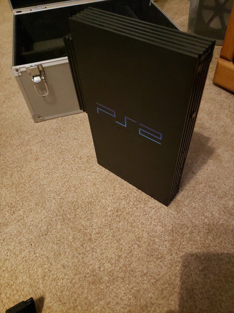 PS2 with 1 Controller, Case And Network Adapter.