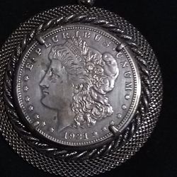 1921 Morgan silver coin with bezel