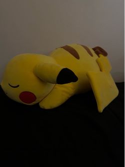 Pikachu sleeping stuffed animal