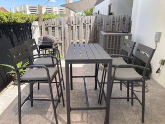 Bar-height patio dinning set with 4 chairs
