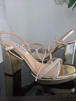 Nina sandals , 8.5 in size. Gold