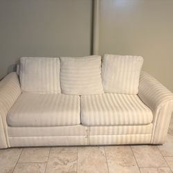 Cream Pull-Out Couch – Comfortable Guest Seating