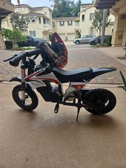 Kids electric dirt bike + helmet + gloves + jersey