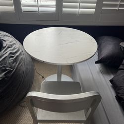 White marble table with a chair