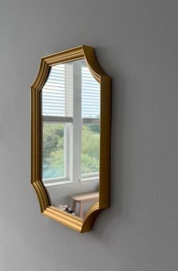 Vintage style mirror with gold colored trim