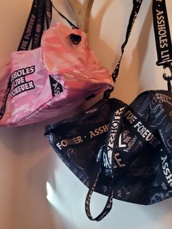 Assholes Live Forever Duffel Bags