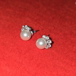 Pair of silver-toned vintage rhinestone and faux pearl stud earrings.
