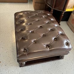 Leather and wood ottoman 
