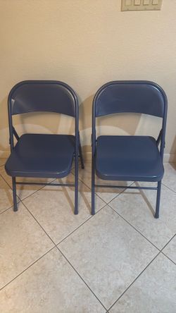 Two metal folding chairs