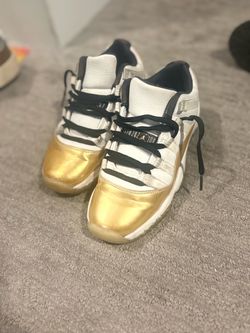 Air Jordan 11 Low Gold Toe Sneakers