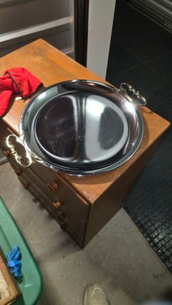 This is a vintage Kromex chrome serving tray featuring distinct gold-tone handles