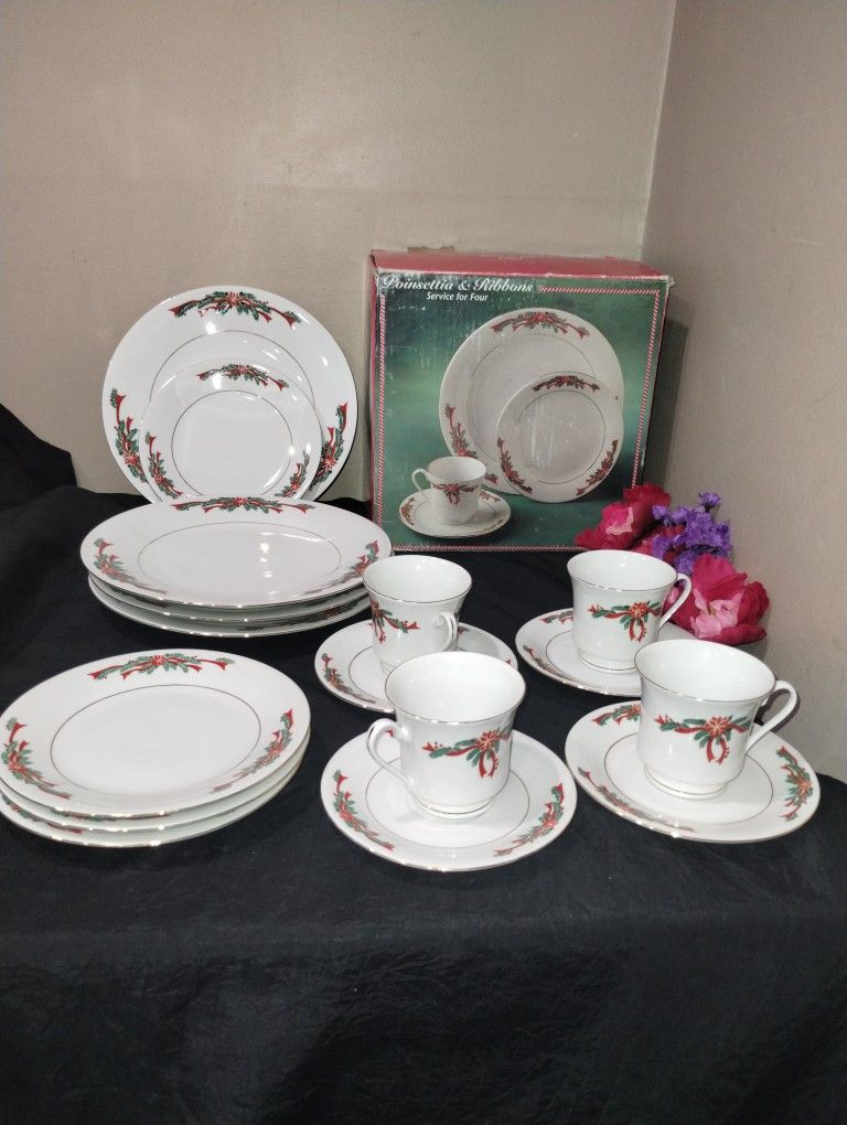 Poinsettia and Ribbons Christmas China by Tienshan with 4 place settings.