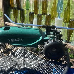 Traveling tractor sprinkler