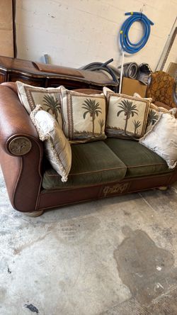 Ornate Loveseat with Palm Tree Pillows